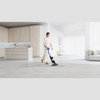Dyson Wash G1 Wet Cleaner in Ultra Blue and Matt Black, showcasing its sleek design and vacuum cleaner features.