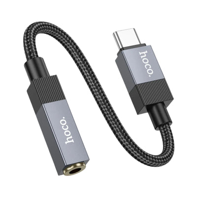 A Hoco USB-C to 3.5mm audio adapter cable on a solid white background, featuring a black braided cable and metallic silver and black connectors.