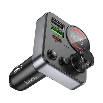 A black car cigarette lighter dual USB charger with an built-in Bluetooth receiver, featuring a digital display screen showing 87.5, two USB-A ports, and a large rotary volume knob.