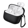 A black silicone protective case for a wireless earbud charging case, shown open with two white earbuds inside and a black carabiner clip attached on the side, set against a plain white background.