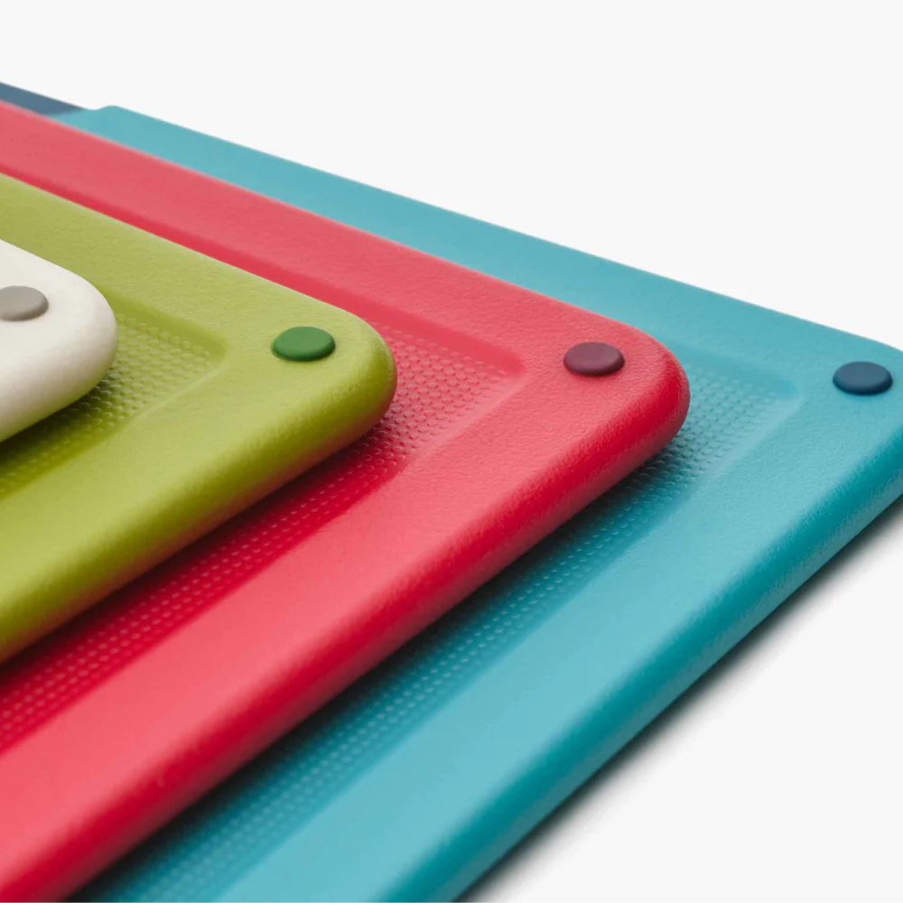 Joseph Joseph Folio Icon large multicolour cutting board set with four boards in varying sizes and colors.