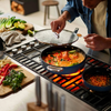 Joseph Joseph blue ceramic non-stick sauté pan with lid, featuring a folding handle, 28cm size displayed on a neutral background.