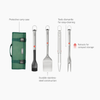 Joseph Joseph GrillOut 4-piece stainless-steel BBQ utensil set with storage case on a wooden surface.