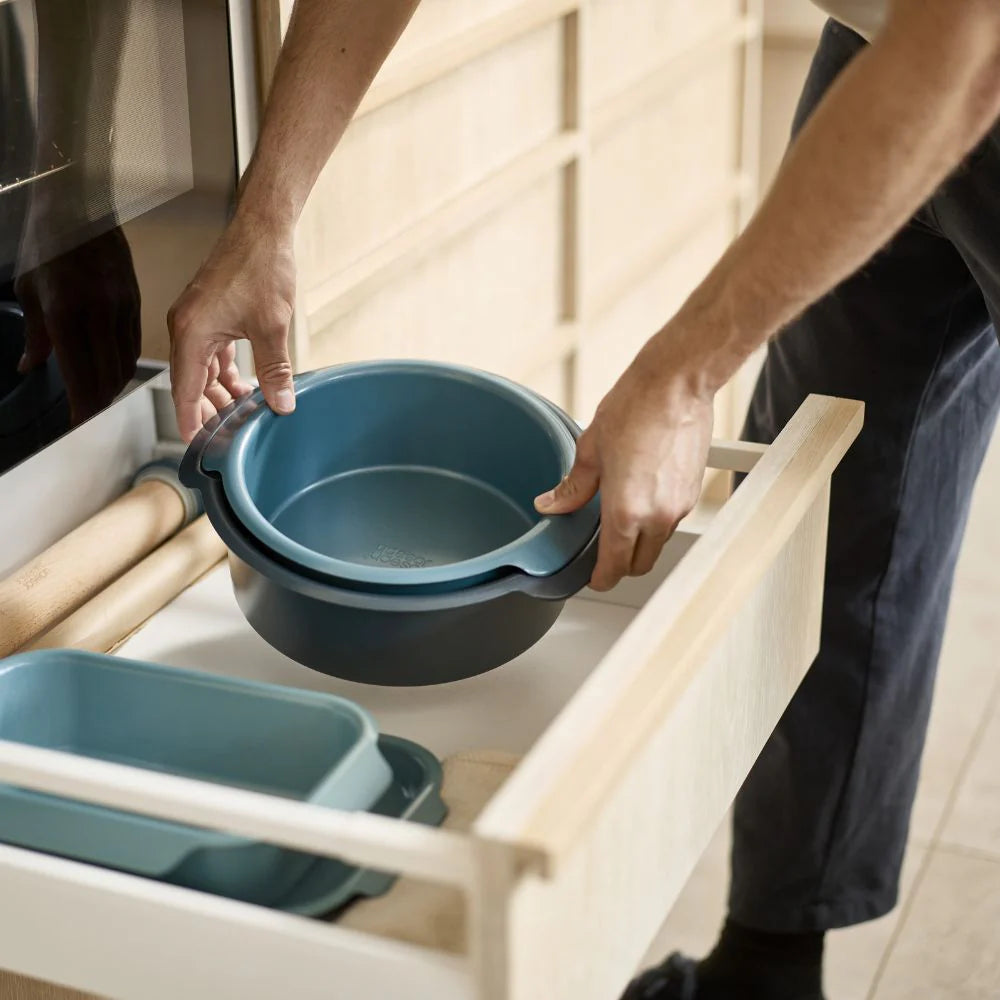 Joseph Joseph Nest Bake non-stick round cake pan set with two pans stacked together, ideal for baking and easy release.