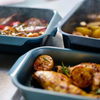 Medium Joseph Joseph Nest oven tray with a sleek design and integrated handles, ideal for baking and roasting.
