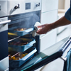 Large Joseph Joseph Nest oven tray with a sleek design and raised edges, ideal for baking and roasting.