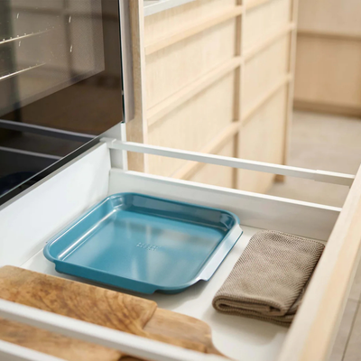Joseph Joseph Nest™ Bake medium non-stick baking tray in blue, showcasing its sleek design and practical size for baking.
