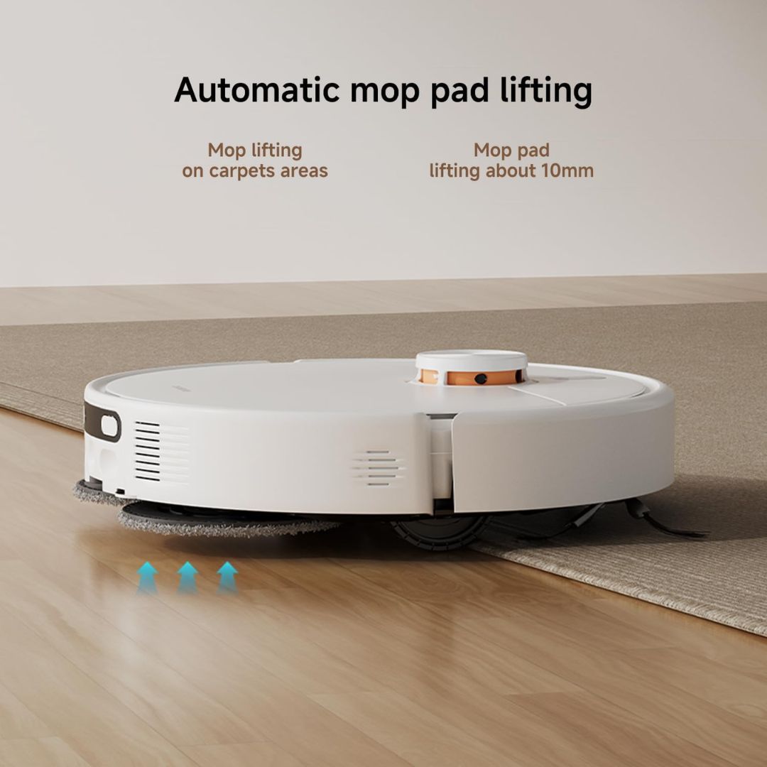 A white robotic floor cleaner is shown on a wood floor and carpet, with text above reading 'Automatic mop pad lifting' and small blue arrows indicating lifting action. No person or animal is present, but this is not a clean isolated studio product shot because it includes a real indoor environment and explanatory overlay, so Lifestyle fits better than Product/Packaging.