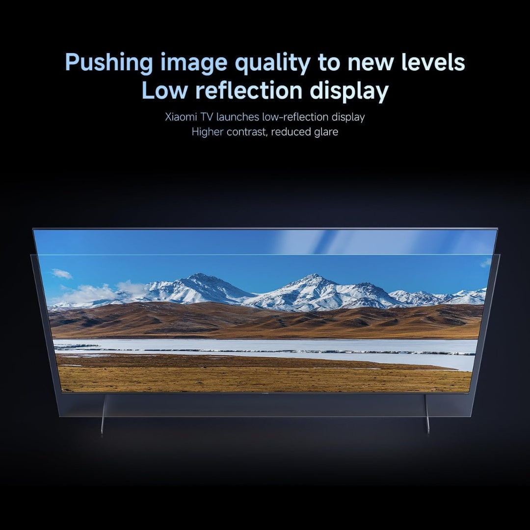 Television displaying a mountain landscape with text about low reflection display technology.