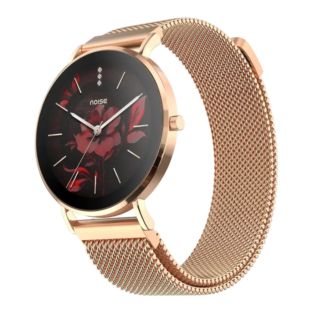 A rose gold women's watch with a mesh metal band, featuring a black round dial decorated with a red floral pattern and the brand name 'noise'.